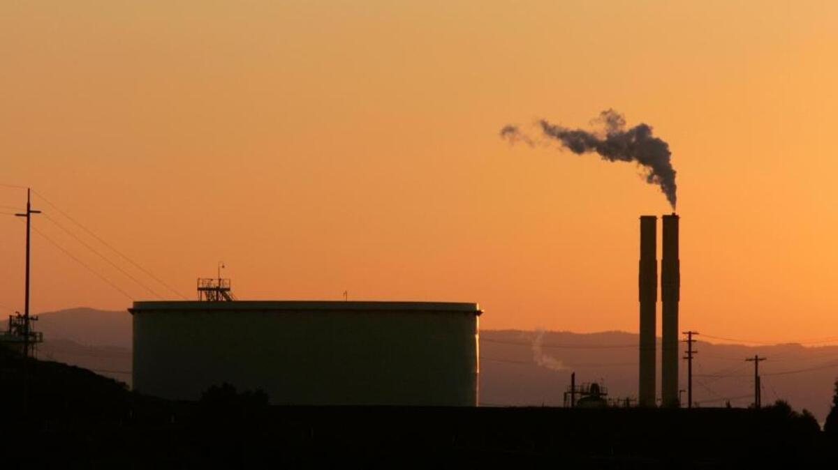This Friday Sept. 22, 2006, file photo, shows an oil refinery at sunset in Rodeo, Calif. California's cap-and-trade law, which puts a cap and a price on carbon emissions, expires in 2020, but Gov. Jerry Brown say he's still hopeful it will be extended, after he failed to convince lawmakers to extend it in tandem with the just-passed state budget.