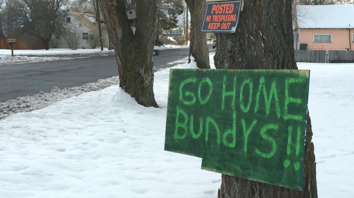 A sign tacked outside a home in Burns, Ore., reflects growing community sentiment that members of the armed group led by Ammon Bundy aren't welcome.