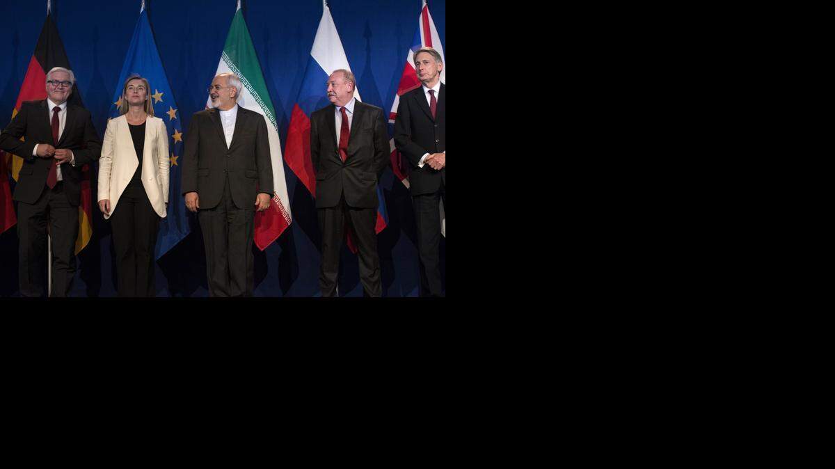 
From left, German Foreign Minister Frank Walter Steinmeier, European Union High Representative Federica Mogherini, Iranian Foreign Minister Mohammad Javad Zarif, Russian Deputy Political Director Alexey Karpov, and British Foreign Secretary Philip Hammond arrive at the Swiss Federal Institute of Technology after Iran nuclear program talks finished with extended sessions. The United States, Iran and five other world powers Thursday announced an understanding outlining limits on Iran’s nuclear program so it cannot lead to atomic weapons, directing negotiators toward achieving a comprehensive agreement within three months. 
