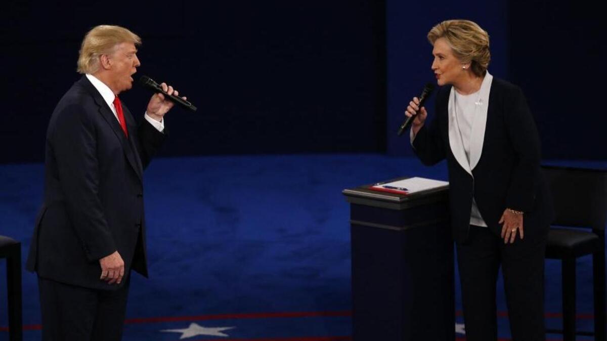 Donald Trump and Hillary Clinton spar at the presidential debate Sunday night at Washington University in St. Louis.
