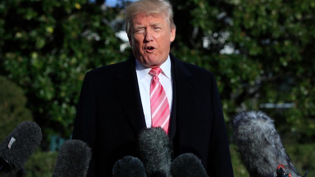 President Donald Trump speaks to reporters on Tuesday before leaving the White House for Thanksgiving trip to his Mar-a-Lago estate in Palm Beach, Fla.