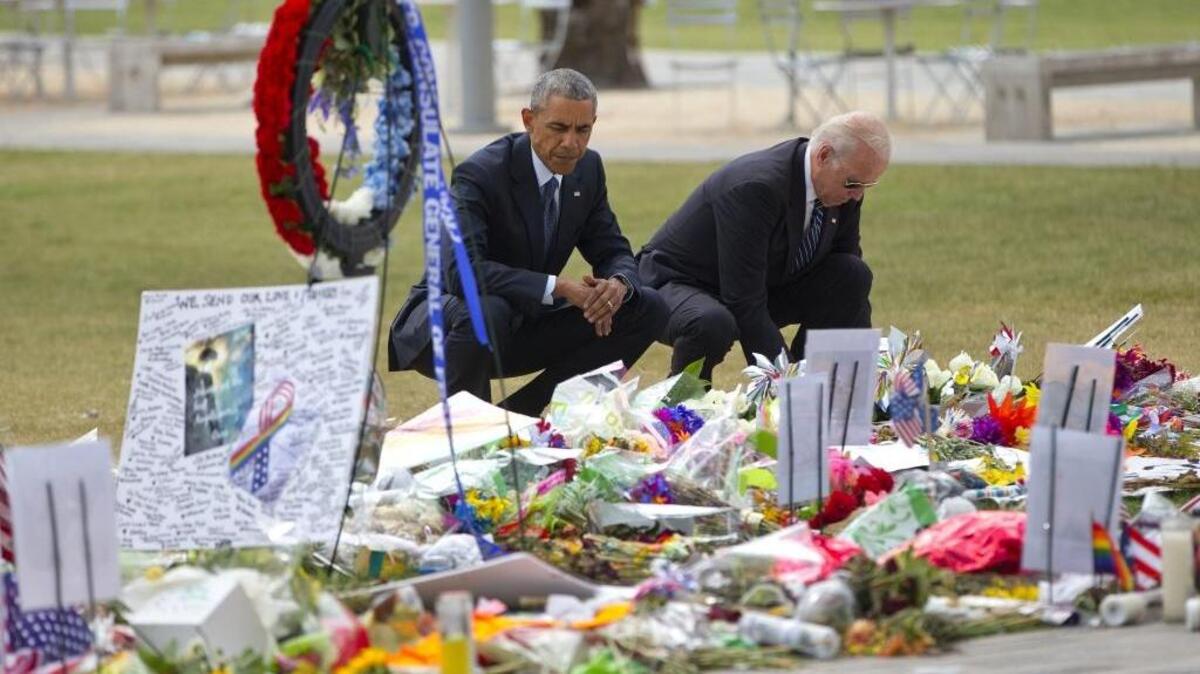 President Barack Obama and Vice President Joe Biden visit a memorial to the victims of the Pulse nightclub shooting on Thursday, June 16, 2016, to console those mourning the deadliest shooting in modern U.S. history.