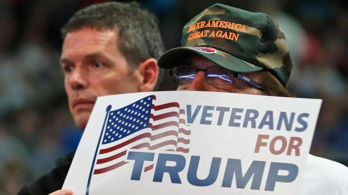 A supporter of Republican presidential candidate Donald Trump holds a sign during a rally in Charleston, W.Va., on May 5.