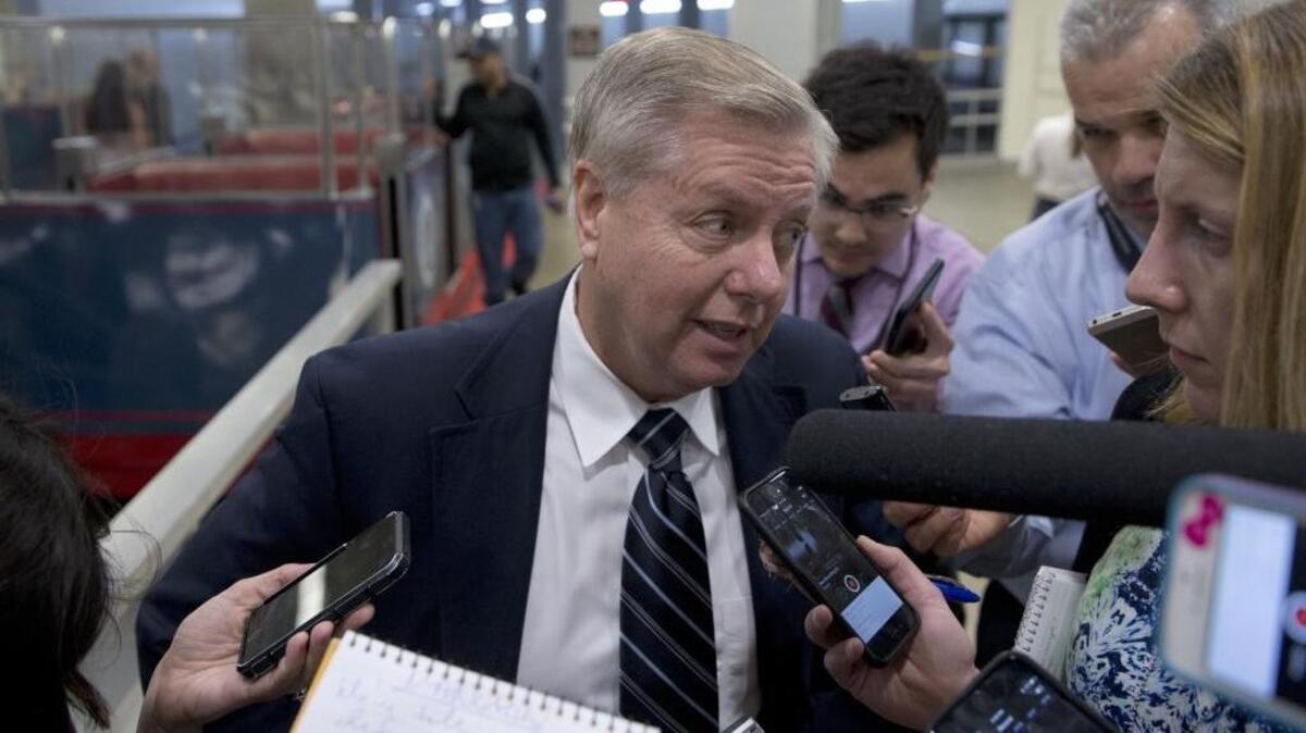 Sen. Lindsey Graham, R-N.C., talks with reporters on Capitol Hill before the Senate voted down measures designed to keep guns out of the hands of terrorists on Monday.