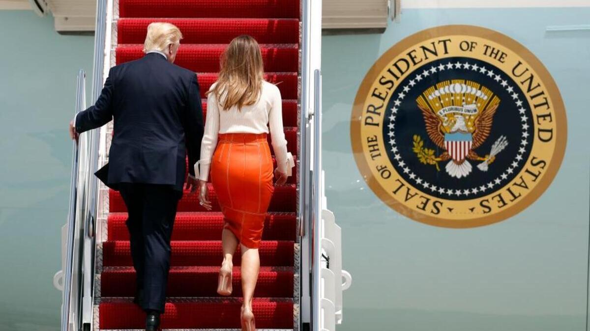 President Donald Trump, with first lady Melania Trump, board Air Force One at Andrews Air Force Base on Friday, prior to his departure on his first overseas trip.