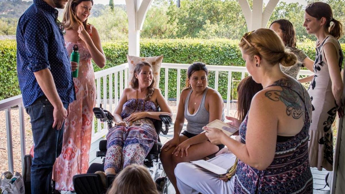 Betsy Davis, third from left, has a laugh with her friends during her going away party in Ojai, Calif., in July. Davis emailed her closest friends and family to invite them to a two-day celebration, telling them: “These circumstances are unlike any party you have attended before, requiring emotional stamina, centeredness and openness. And one rule: No crying.” The 41-year-old woman diagnosed with ALS held the party to say goodbye before becoming one of the first California residents to take life-ending drugs under a new law that gave such an option to the terminally ill.