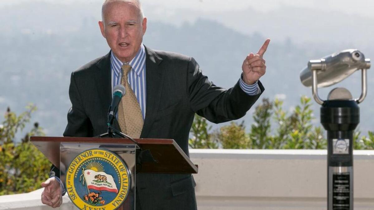 Gov. Jerry Brown speaks before signing a bill to combat climate change during a ceremony this month at Griffith Observatory in Los Angeles.