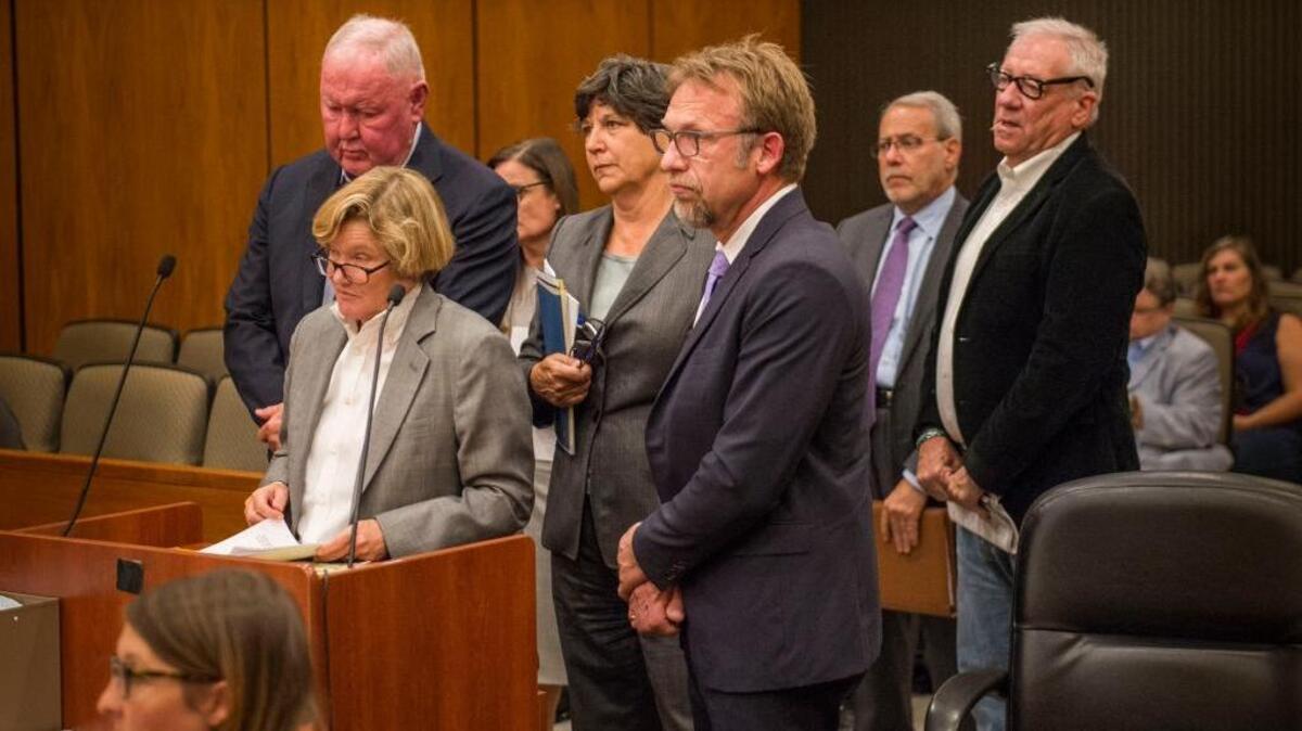 Backpage.com CEO Carl Ferrer, center, and controlling shareholders James Larkin, left Michael Lacey, right, listen to Sacramento County Superior Court Judge Lawrence Brown in an August hearing.