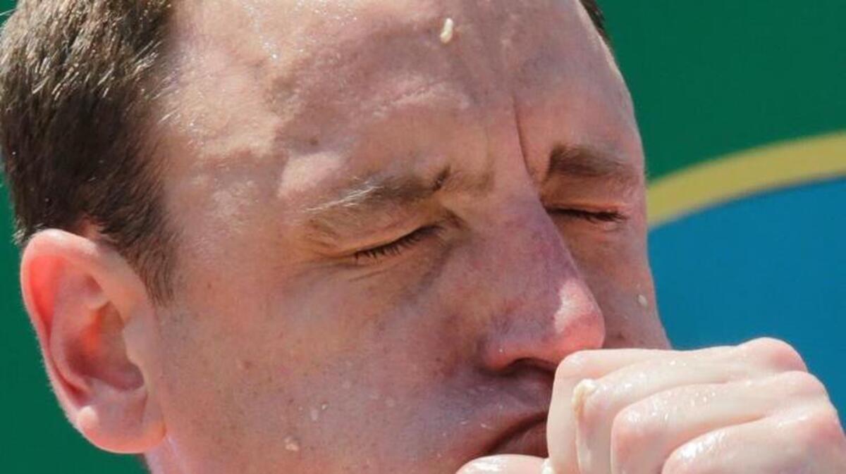 Joey Chestnut eats two hot dogs at a time during the Nathan's Annual Famous International Hot Dog Eating Contest on July 4 in New York.