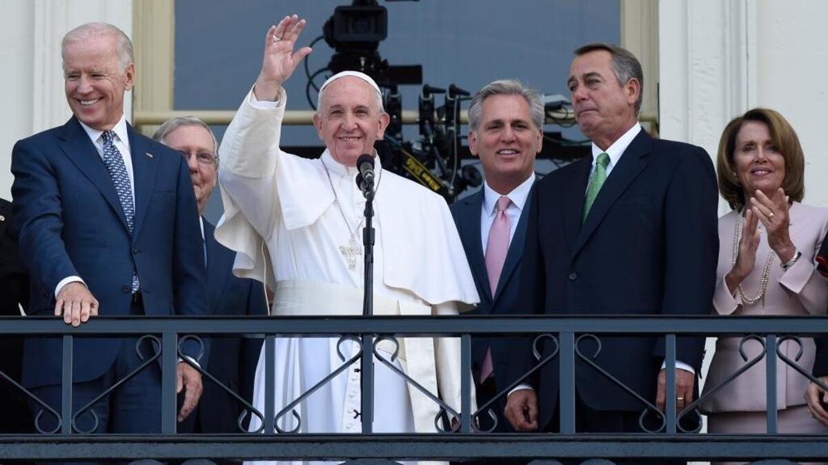 
Pope Francis waves to the crowd on Capitol Hill as he stands with Vice President Joe Biden, Senate Majority Leader Mitch McConnell, House Majority Leader Kevin McCarthy, House Speaker John Boehner and Democratic Minority Leader Nancy Pelosi.
