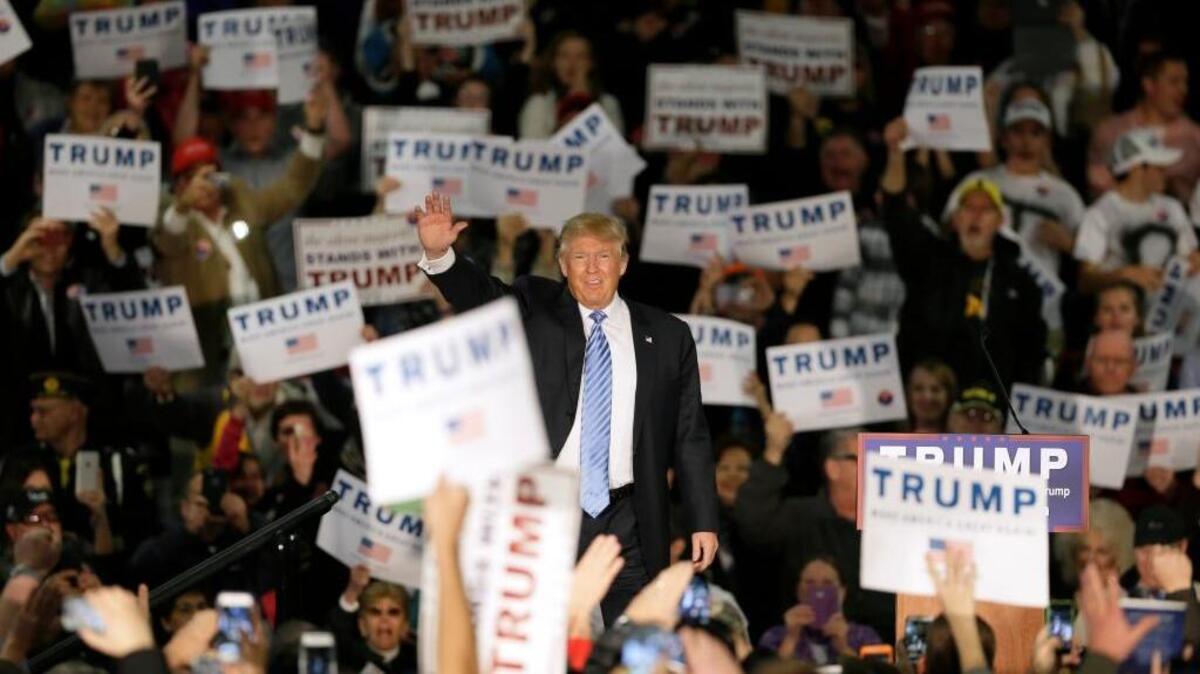 Republican presidential candidate Donald Trump greets supporters before speaking at a campaign rally in Davenport, Iowa, on Dec. 5.