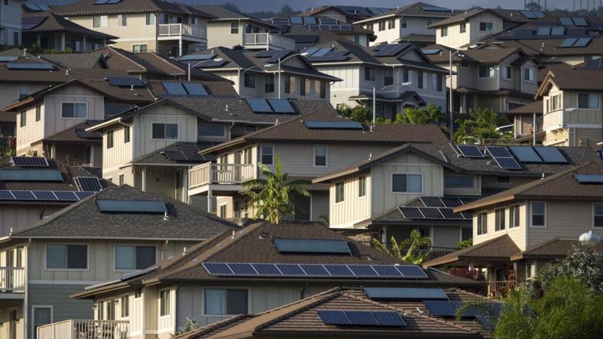 Solar panels cover the rooftops of homes in Kapolei, Hawaii.