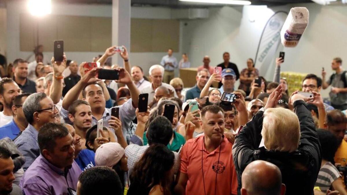 President Donald Trump on Tuesday throws rolls of paper towels to a crowd affected by Hurricane Maria while Puerto Rico in the wake of Hurricane Maria.