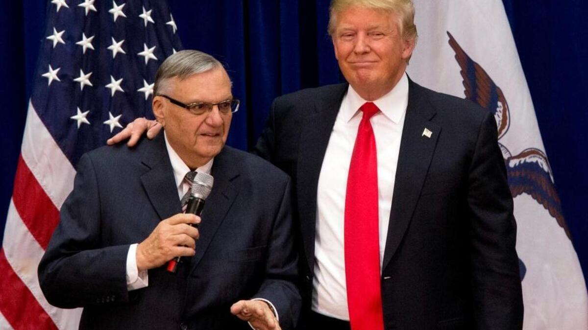 In this Januarary 2016, then-Republican presidential candidate Donald Trump was joined by Joe Arpaio, then sheriff of metro Phoenix, at a campaign event in Marshalltown, Iowa.