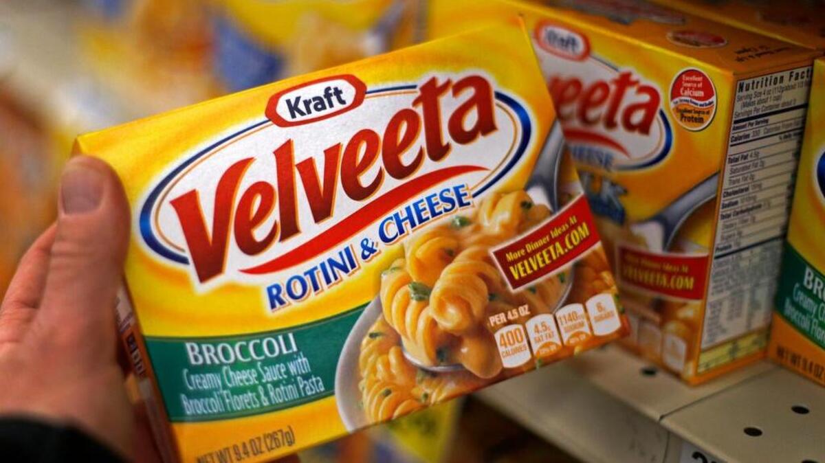 
Kraft Velveeta rotini and cheese is displayed at a grocery in Pittsburgh. On Aug. 12, Kraft Heinz announced it would cut about 2,500 jobs as part of its plan to slash costs after the food companies combined. 
