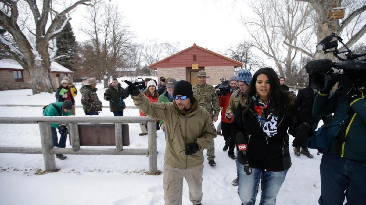A member of the armed anti-government group occupying the Malheur National Wildlife Refuge headquarters near Burns, Ore., conducts a tour with the media on Monday.