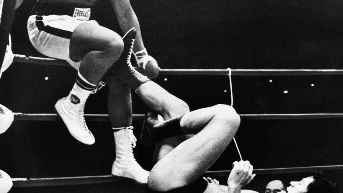 In 1976, Muhammad Ali is shown trying to evade kicks by wrestler Antonio Inoki.