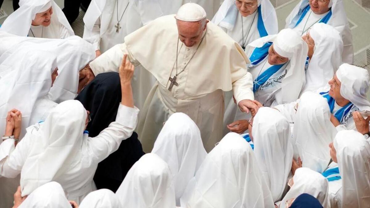 Pope Francis is greeted by a group of nuns during his weekly general audience at the Vatican on Aug. 22. In a letter this week, he apologized for sexual abuse by priests.