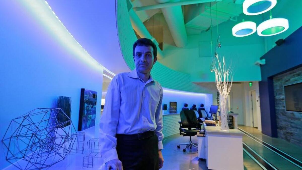 Technical director Dragos Maciuca poses in August in the lobby of the Ford Motor Co.’s Research and Innovation Center in Palo Alto. Joe Mathews says that the bright lights from Silicon Valley always shine on us.