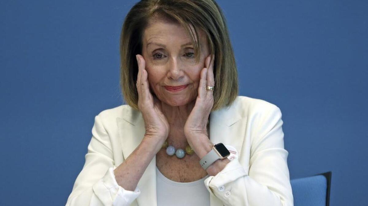 Rep. Nancy Pelosi reacts to accounts of the massacre at Marjory Stoneman Douglas High School during a roundtable on gun violence at Coral Springs City Hall on Wednesday.