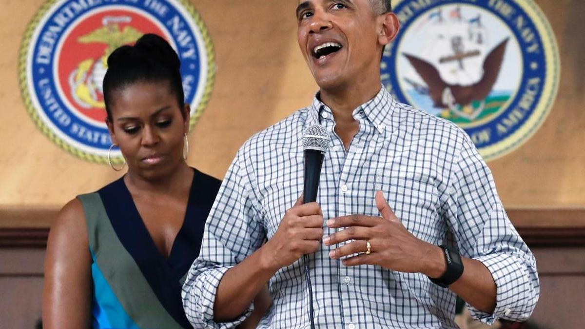 President Barack Obama, joined by first lady Michelle Obama, thanks service members and their families at Marine Corps Base Hawaii in Kaneohe Bay on Sunday.