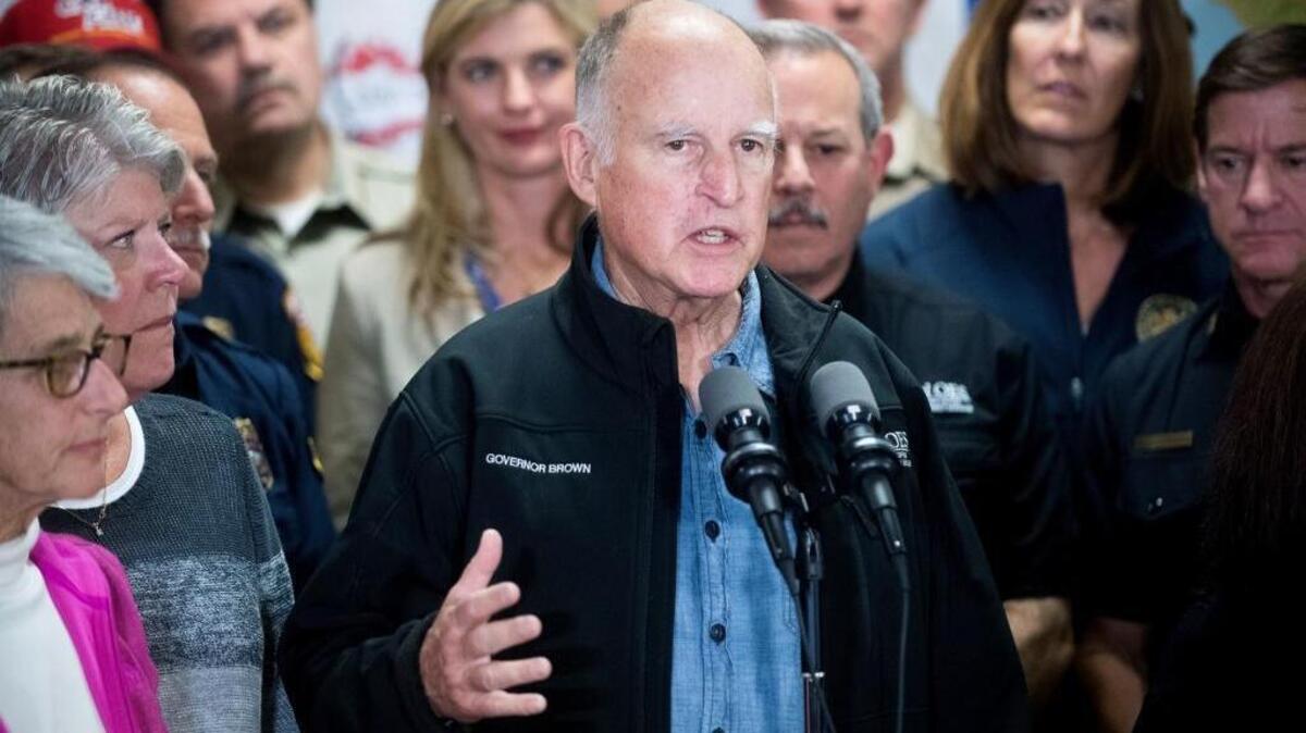 Gov. Jerry Brown discusses the Southern California wildfires during a press conference on Dec. 9 in Ventura.