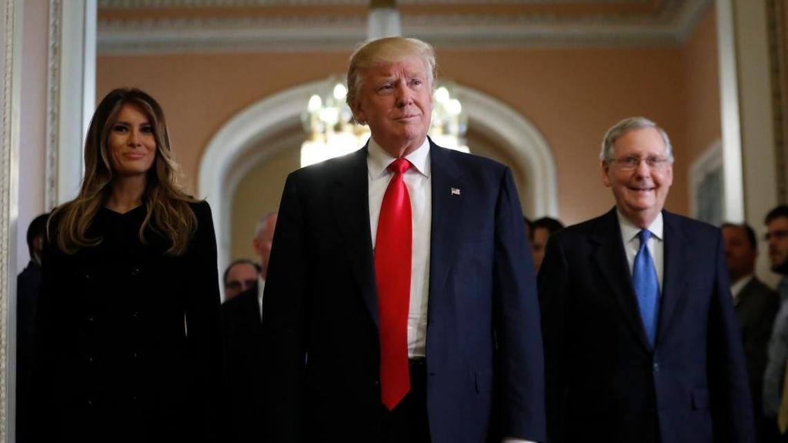 President-elect Donald Trump and his wife, Melania, walk with Senate Majority Leader Mitch McConnell after meeting on Capitol Hill on Thursday.