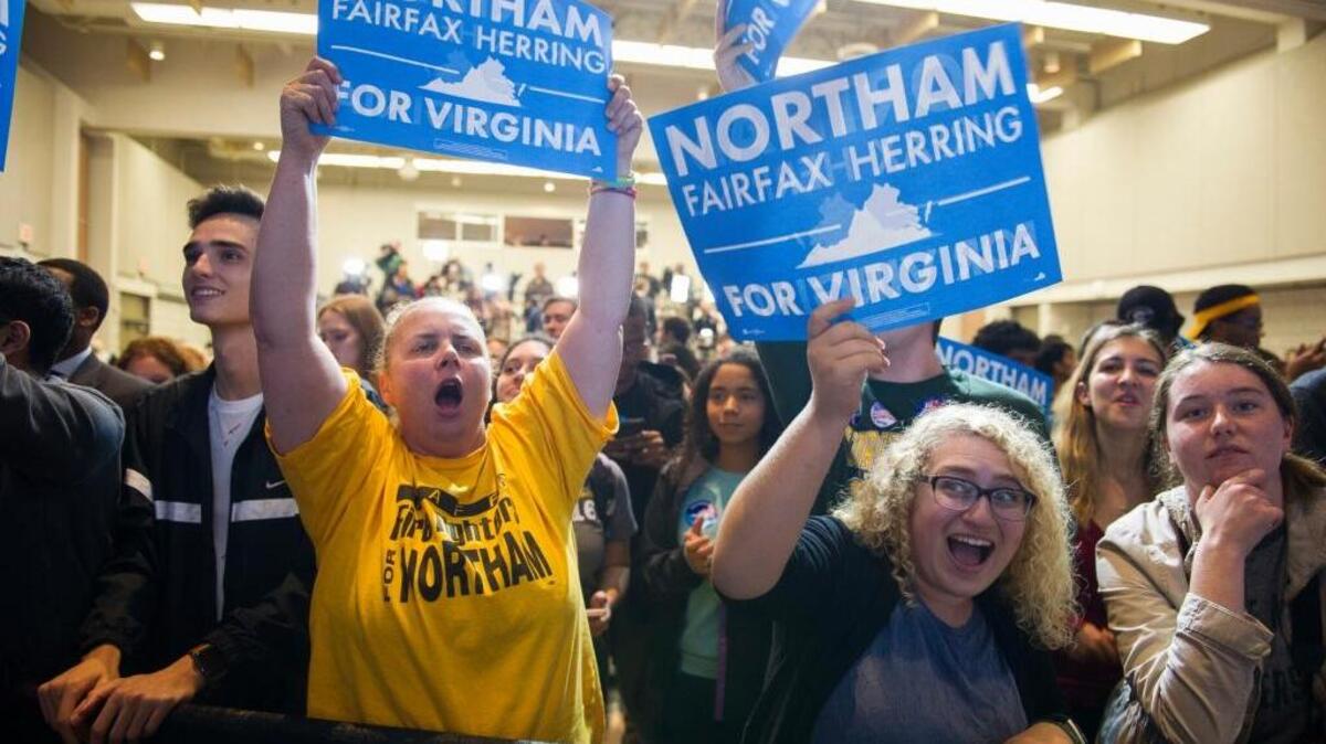 Supporters celebrate Democrat Ralph Northam’s victory in the Virginia governor’s race Tuesday night at George Mason University in Fairfax, Va.