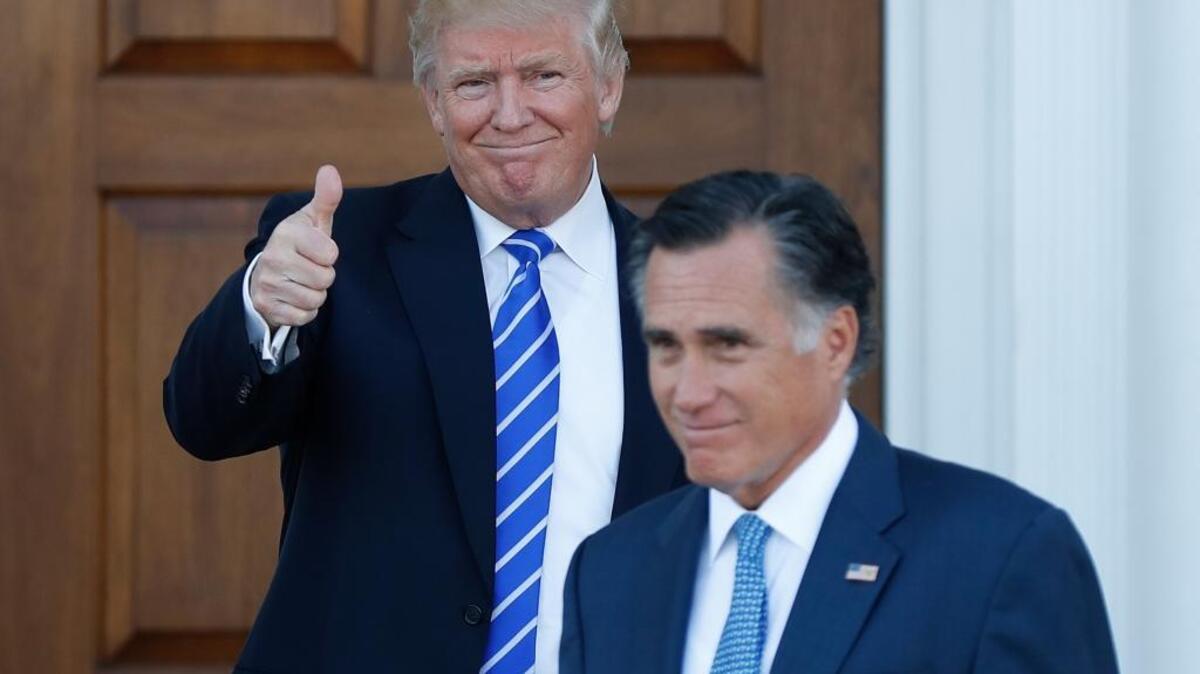 President-elect Donald Trump gives the thumbs-up as Mitt Romney leaves after a meeting on Nov. 19, but he passed over Romney as his nominee for secretary of state.