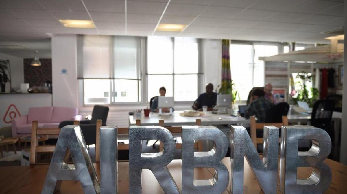 Employees of online lodging service Airbnb work in company’s offices in Paris in 2015.