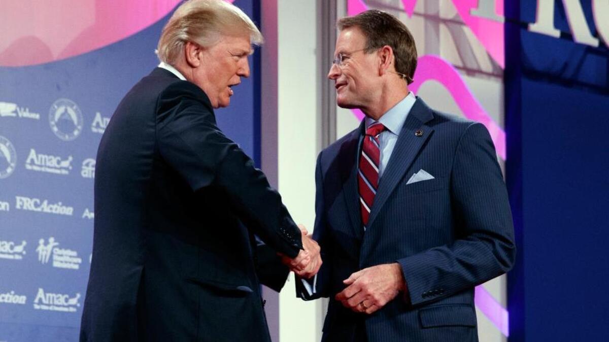 President Donald Trump shakes hands with Family Research Council president Tony Perkins at the 2017 Value Voters Summit on Friday.