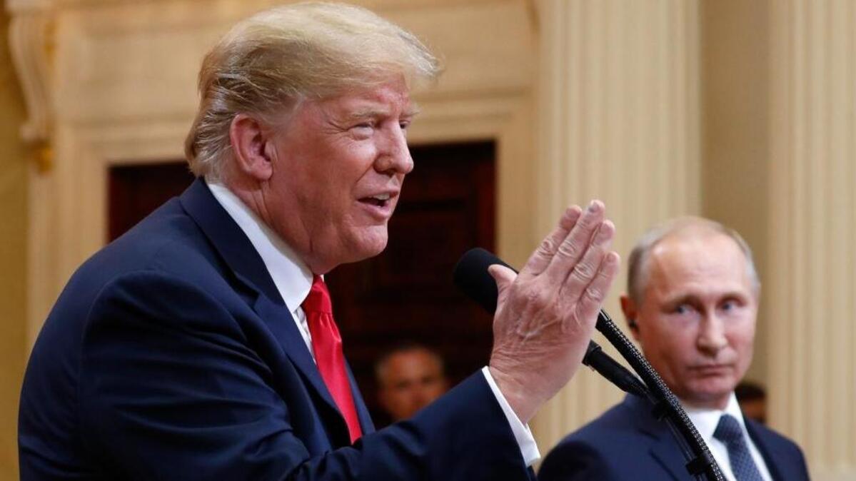 U.S. President Donald Trump speaks with Russian President Vladimir Putin during a press conference after their meeting at the Presidential Palace in Helsinki, Finland, Monday, July 16, 2018. (AP Photo/Pablo Martinez Monsivais)