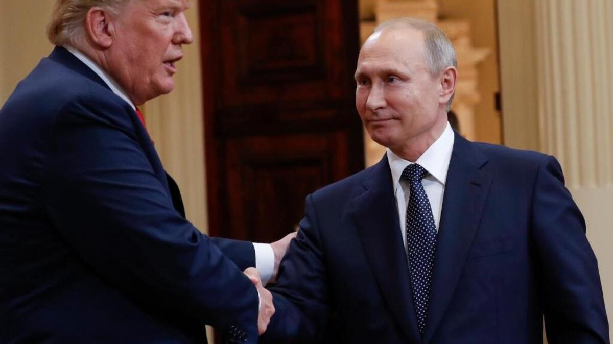 U.S. President Donald Trump, left, and Russian President Vladimir Putin, right, shake hands at the conclusion of their joint news conference at the Presidential Palace in Helsinki, Finland, Monday, July 16, 2018. (AP Photo/Pablo Martinez Monsivais)