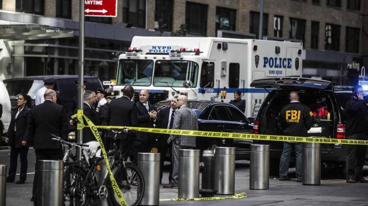 The New York Police Department investigates a bomb scare at CNN headquarters in Manhattan on Wednesday.