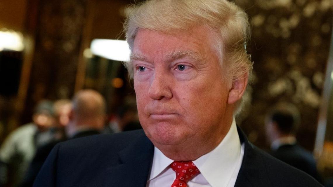 President-elect Donald Trump listens to a question as he talks to reporters after meeting with Alibaba Executive Chairman Jack Ma at Trump Tower in New York, Monday, Jan. 9, 2017.