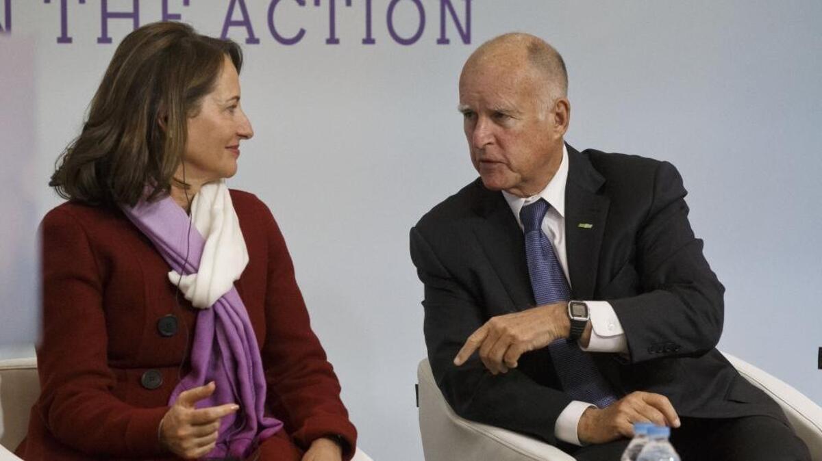 Gov. Jerry Brown speaks in December with French Environment Minister Segolene Royal at the United Nations Climate Change Conference near Paris, where Brown met with French philosopher Jean-Pierre Dupuy.