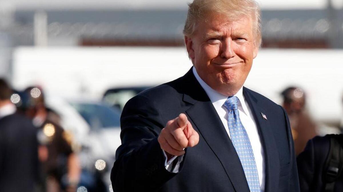 President Donald Trump boards Air Force One in Indianapolis.