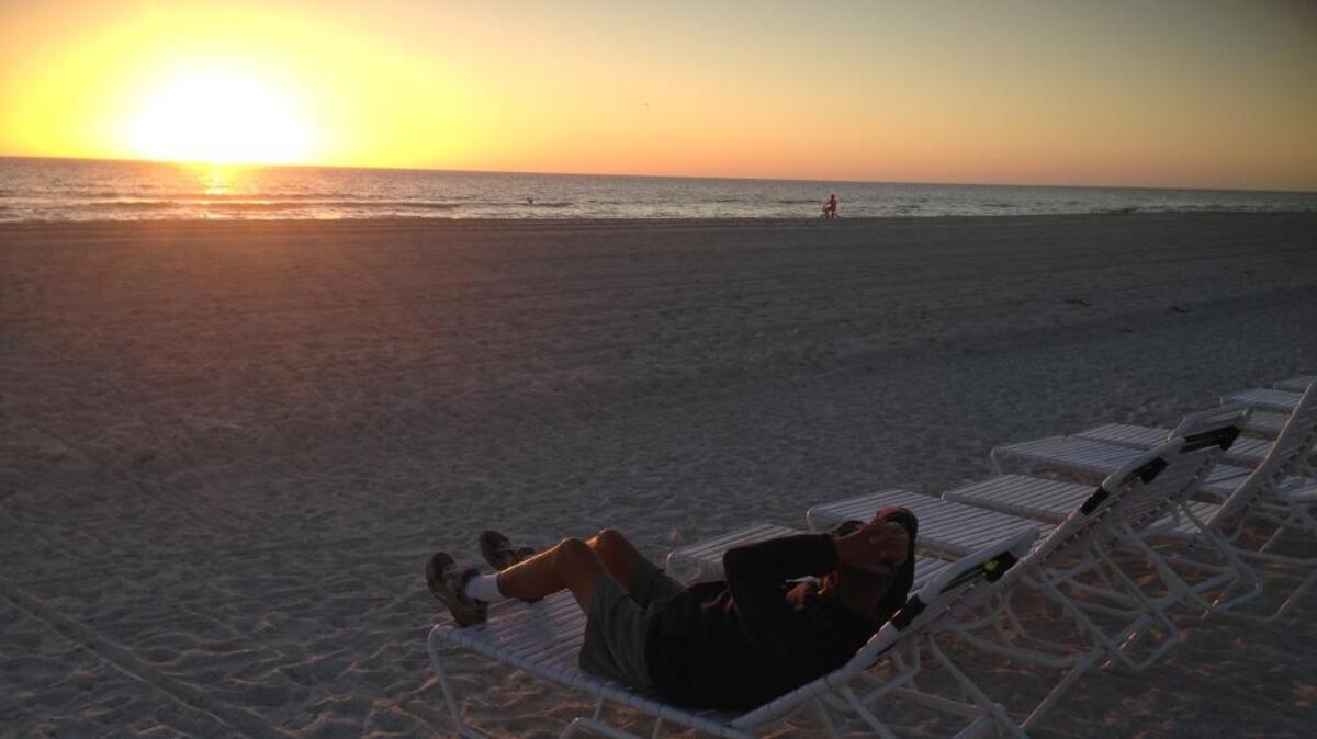 William Francis Whalen kicks back on the beach last March at Anna Maria Island, Fla., watching the sun settle into the Gulf of Mexico.