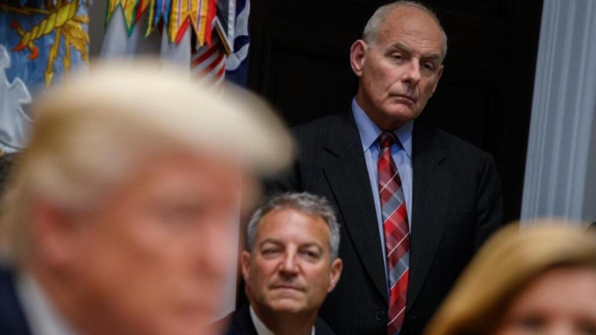 White House chief of staff John Kelly listens as President Donald Trump speaks during a meeting on tax policy with business leaders in the Roosevelt Room of the White House on Oct. 31.