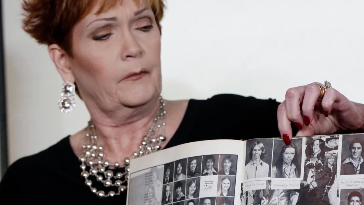 Beverly Young Nelson, the latest accuser of Alabama Republican Roy Moore, points to her photo in her high school yearbook during a news conference in New York on Monday.