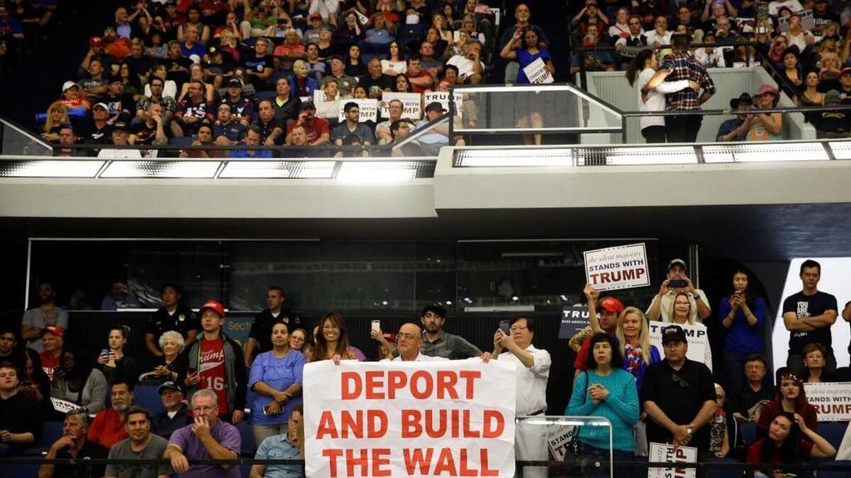 Supporters listen to Donald Trump during a rally at the Anaheim Convention Center on Wednesday.