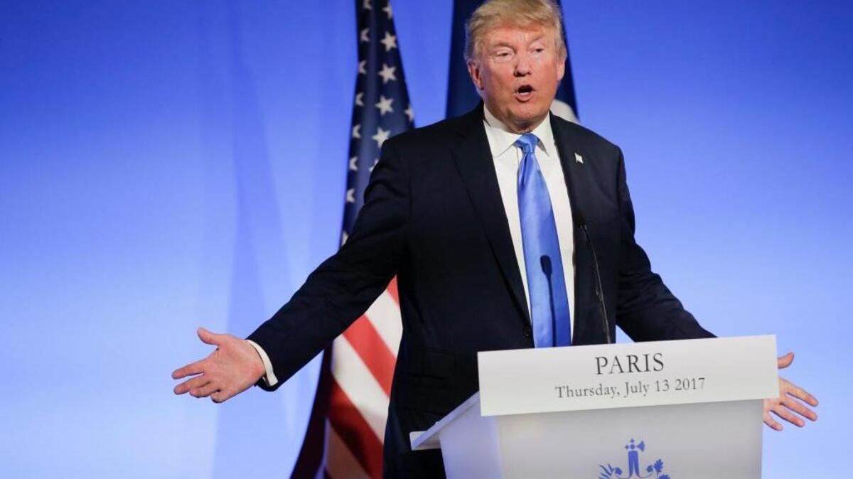 At a press conference with French President Emmanuel Macron at the Elysee Palace in Paris on Thursday, President Donald Trump defended his son Donald Trump Jr. for meeting with a Russian lawyer to get dirt on Democrat Hillary Clinton during the 2016 campaign.