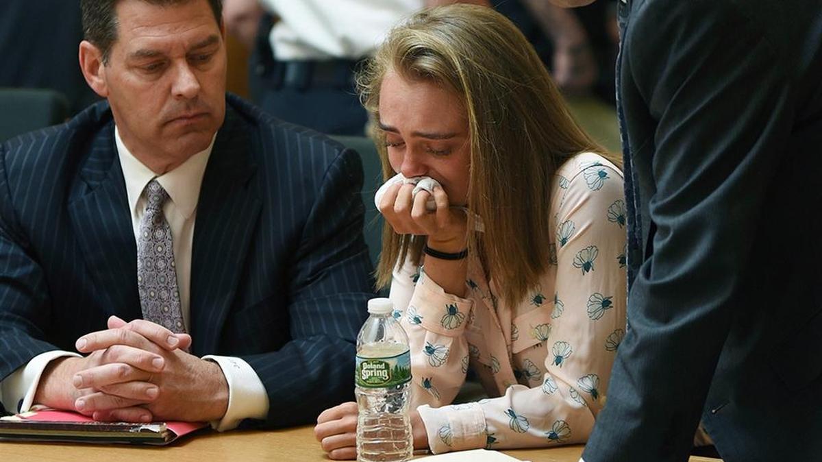 Michelle Carter cries while flanked by her defense attorneys after being found guilty in Taunton, Mass., on Friday of involuntary manslaughter in the suicide of Conrad Roy III.