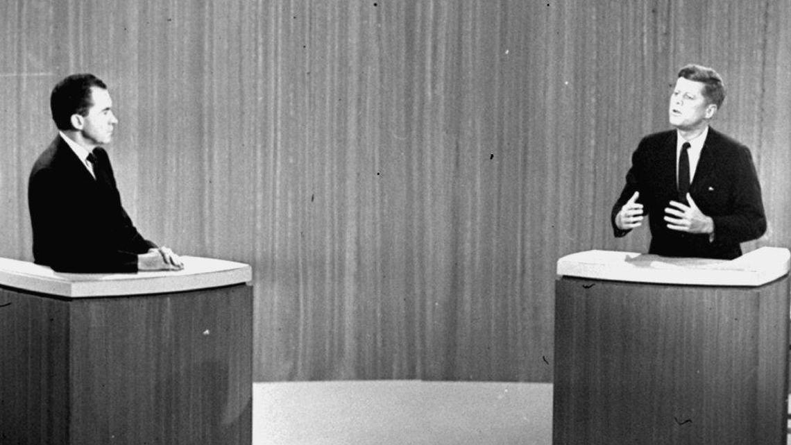 In this 1960 file photo, Sen. John F. Kennedy, D-Mass., right, speaks and Vice President Richard M. Nixon listens during the fourth presidential debate from a New York studio.