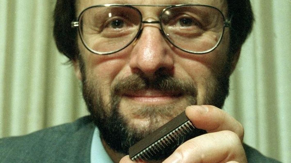 Gilbert Hyatt displays one of his micro computer chips in his La Palma, California home August 30, 1990. 