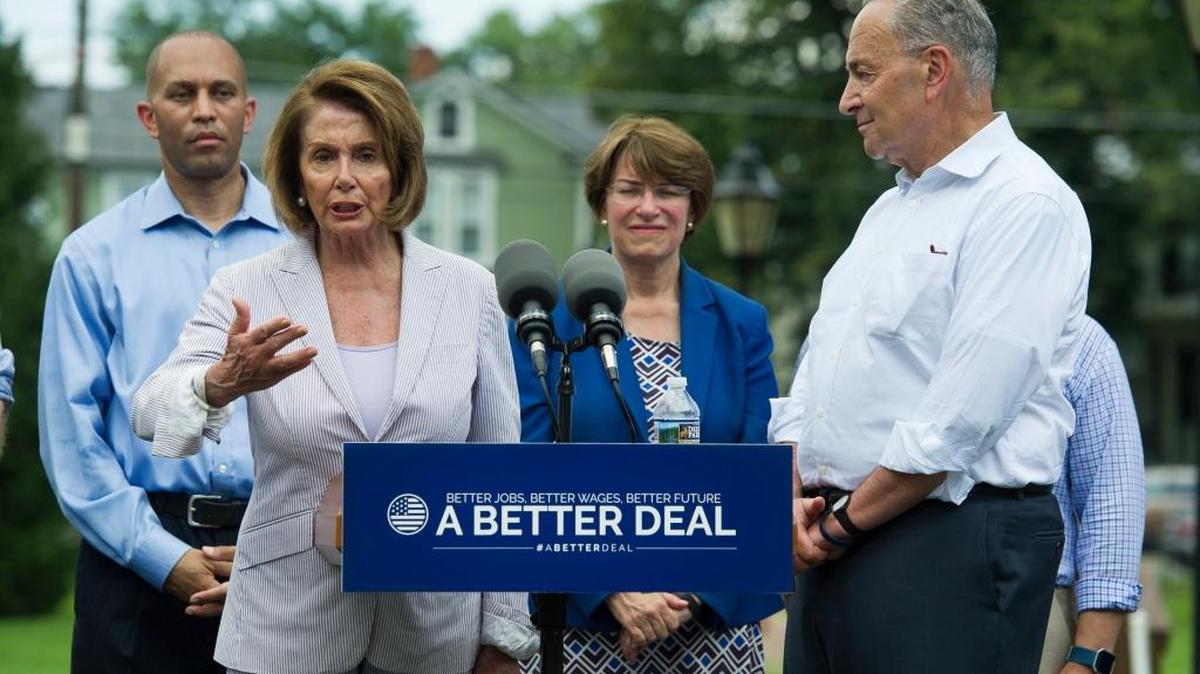 House Democratic Leader Nancy Pelosi of California, accompanied by other Democrats, speaks in a park in Berryville, Va. on Monday to unveil the Democrats new economic agenda.