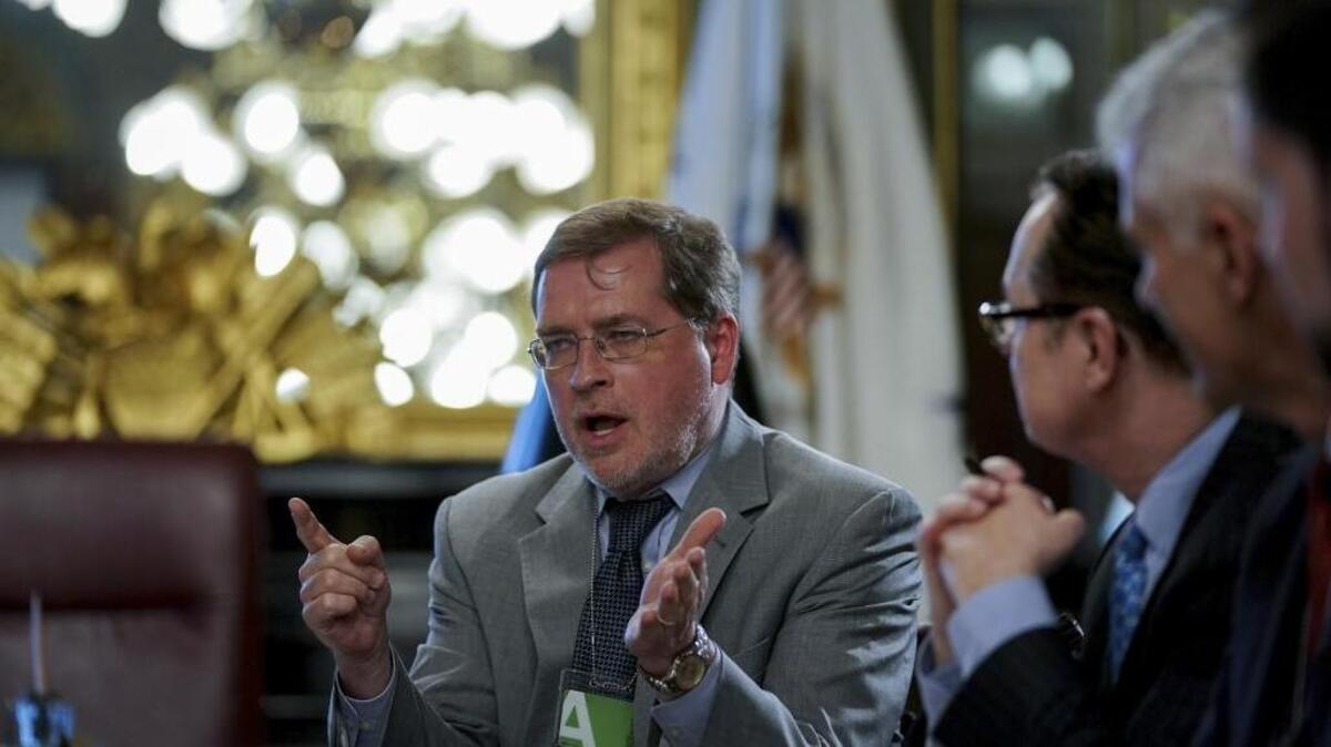 Grover Norquist of Americans for Tax Reform, left, speaks during a meeting held in May by Mick Mulvaney, President Donald Trump’s budget director.