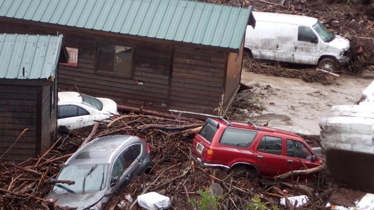 Cabins and vehicles are swept away by storm runoff at El Capitan Canyon Resort & Campground in Santa Barbara County in January. The longer-term challenge for the county is the state’s highest child poverty rate.