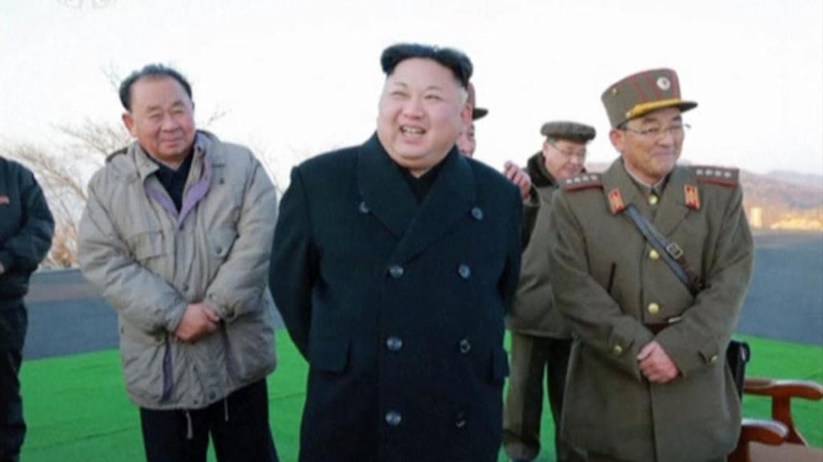 In this images made from video released by KRT on March 7, North Korean leader Kim Jong Un, center, reacts during the launch of four missiles in an undisclosed location North Korea. Kim Jong-un has likely taken the storyline of a movie about him and twisted it to kill his half brother.