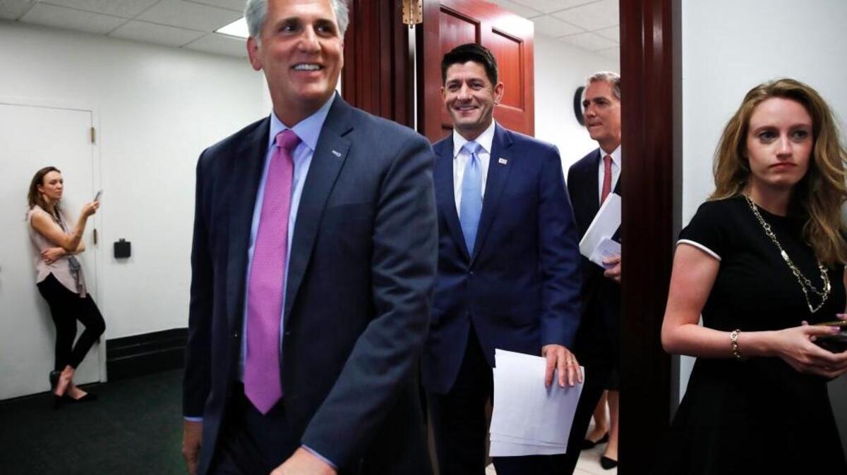 House Majority Leader Kevin McCarthy of Calif., left, House Speaker Paul Ryan of Wis., and Rep. French Hill, R-Ark., walk to a news conference following a GOP caucus meeting, Tuesday, July 24, 2018, on Capitol Hill in Washington. (AP Photo/Jacquelyn Martin)